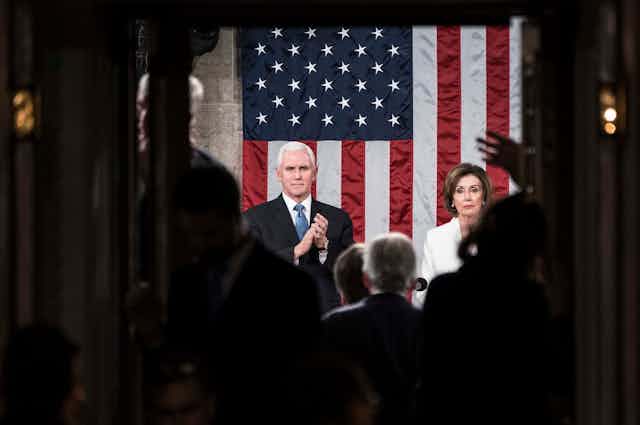 Pence and Pelosi in front of an American flag