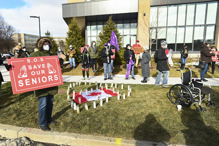 People protesting outside a care home
