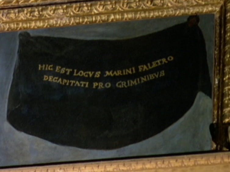 Framed painting of a black shroud with Latin inscription.