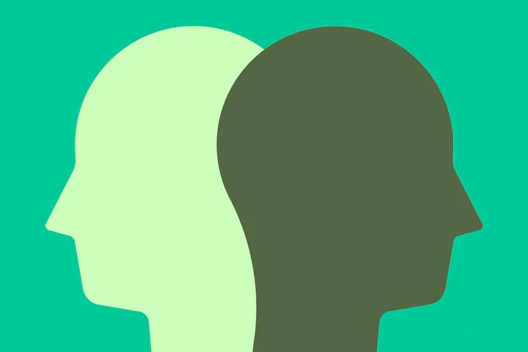 Black and white heads against a green background
