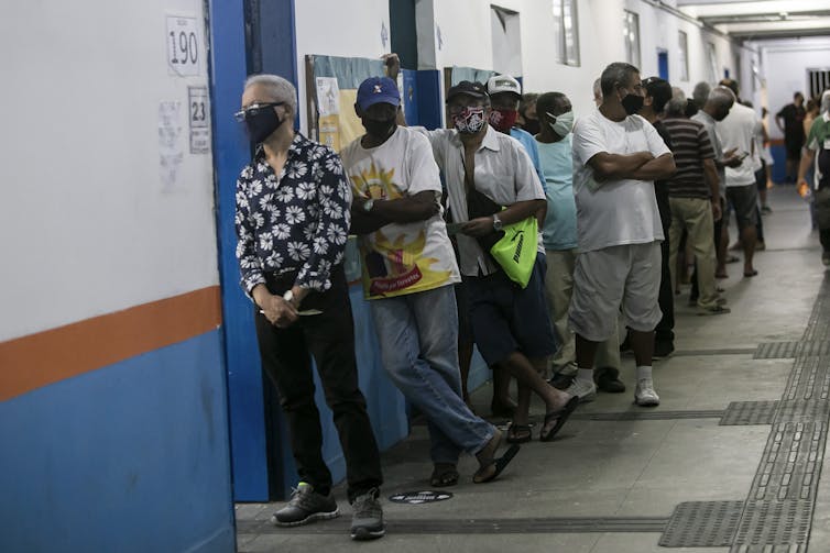 Line of mostly Black voters in face masks