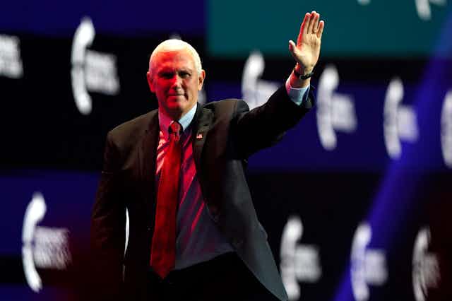 Vice President Mike Pence waves after speaking during the Turning Point USA Student Action Summit, Tuesday, Dec. 22.