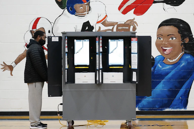 A voter casts a ballot