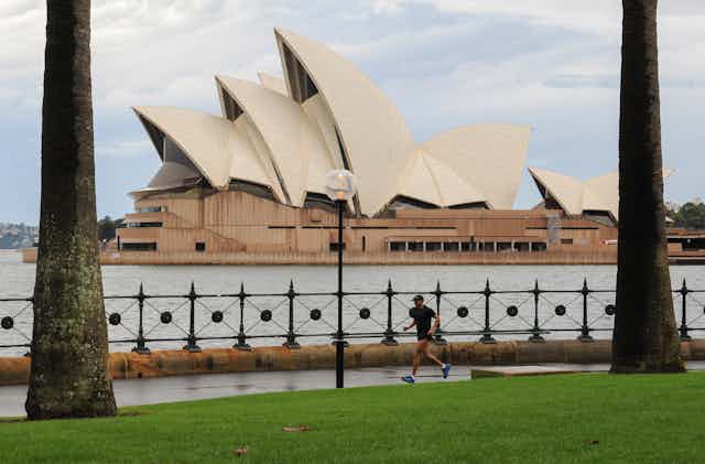 Jogger seen in front of Sydney Opera House