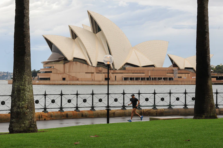 Jogger seen in front of Sydney Opera House