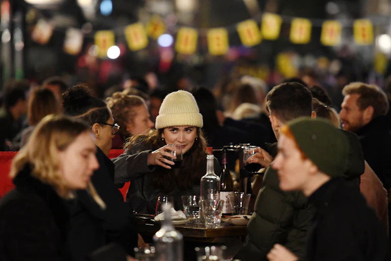 People enjoying a night out before national lockdown.