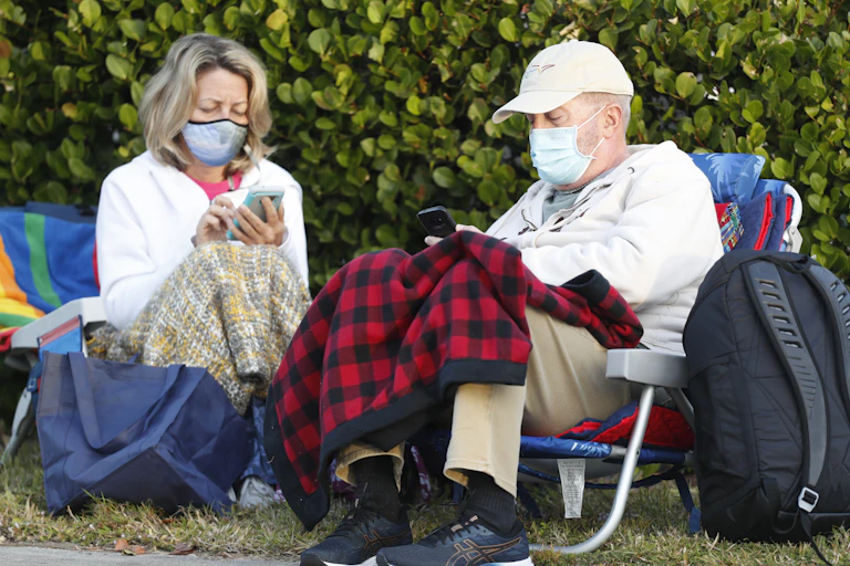 Seniors wait for the COVID-19 vaccine.