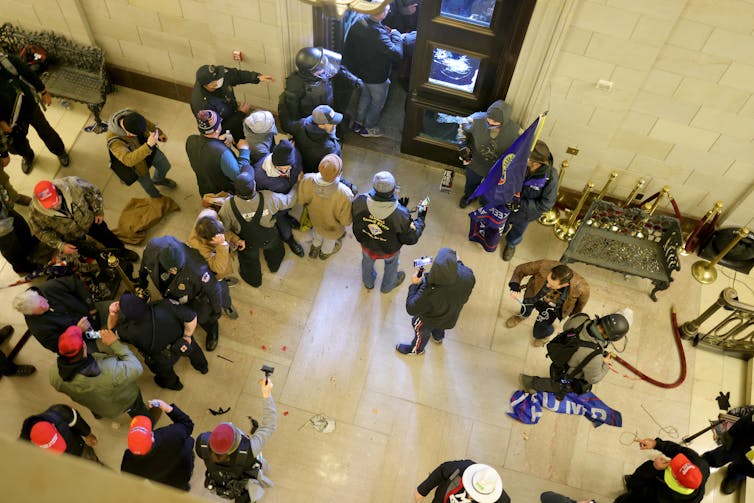 Protesters enter the Capitol building.