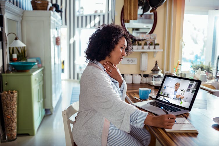 A woman on a teledentistry consult.