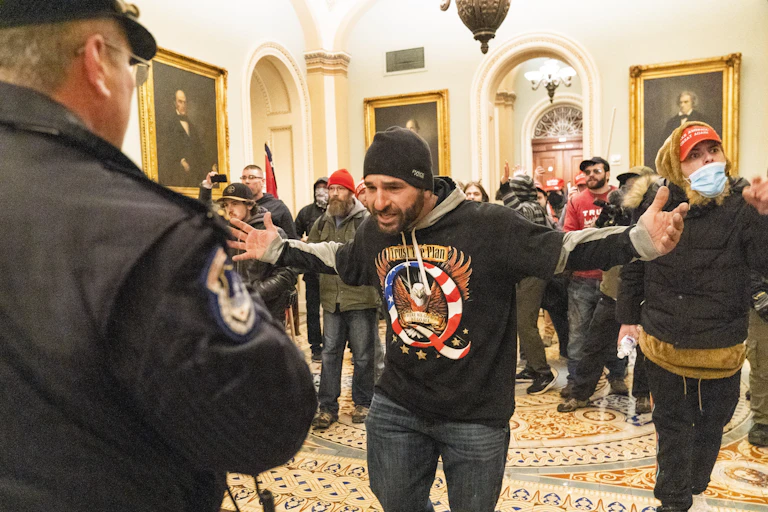 Protesters mill about the area outside of the U.S. Senate Chamber.