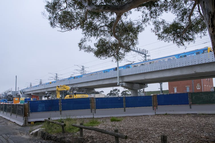 open space being landscaped under rail line