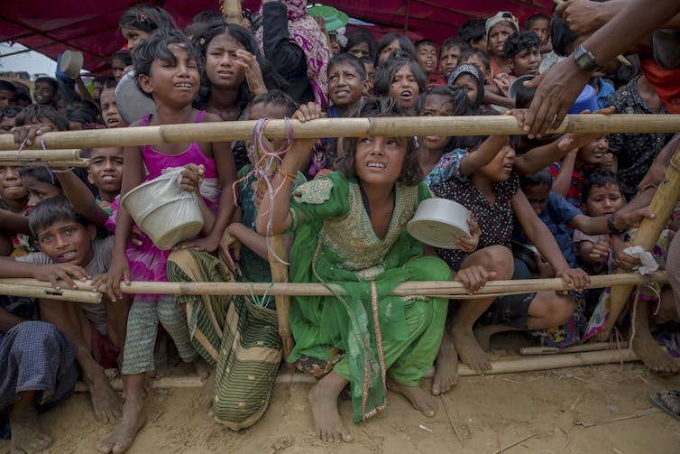 Rohingya children wait for food to be distributed by Turkish aid workers at the Thaingkhali refugee camp in Bangladesh in October 2017.