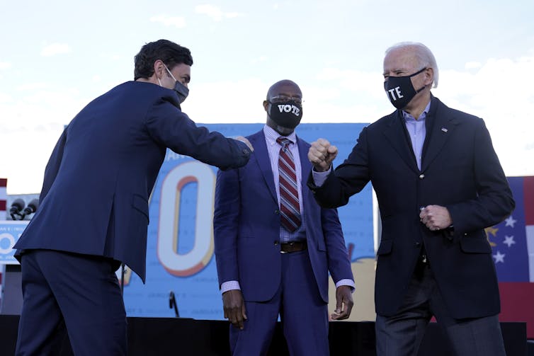 Ossoff, Warnock and Biden at a pre-election rally in Georgia