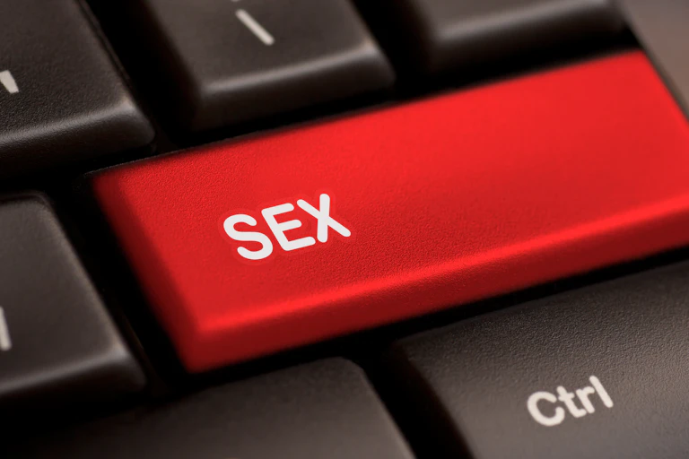 A red button on keyboard reading 'sex'