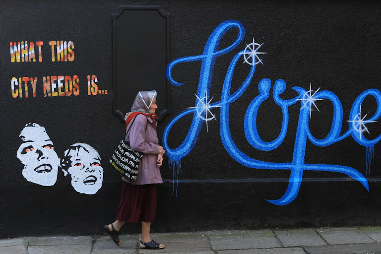A mural reads: What this city needs is hope.