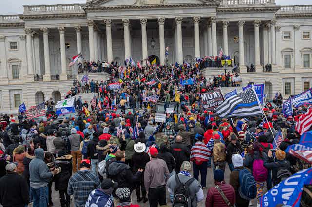 image shows a crowd of Trump supporters on the steps of Capitol Hill on January 6, 2020.