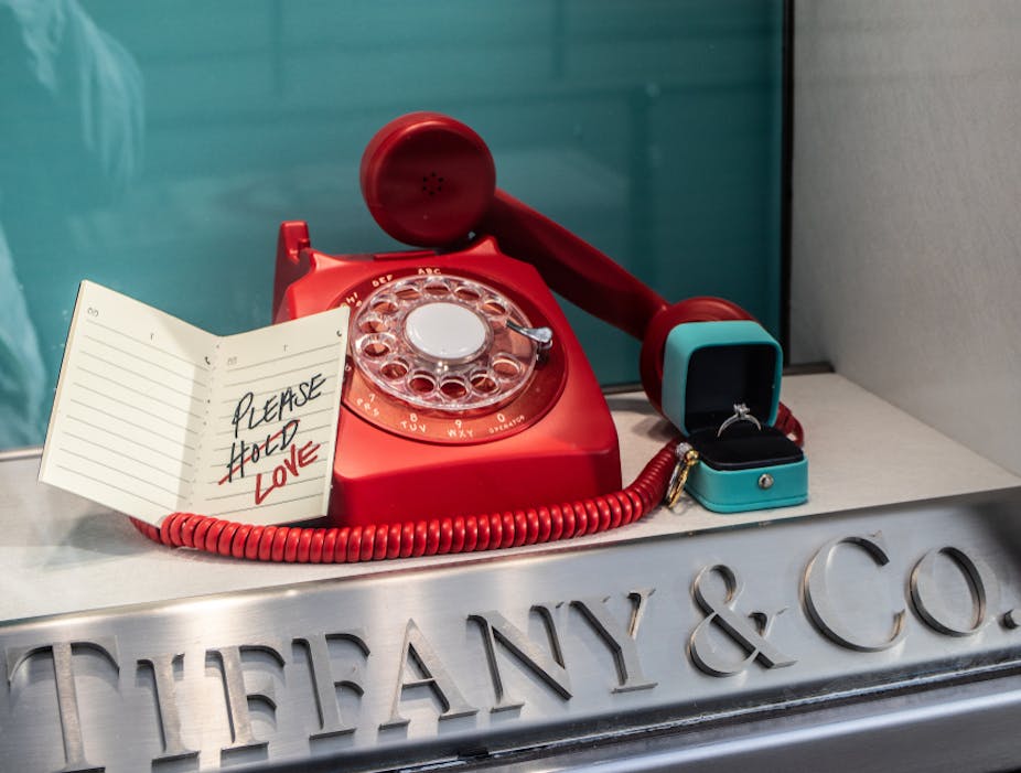 Tiffany shop window with a red phone and a ring. 
