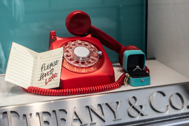 Tiffany shop window with a red phone and a ring.