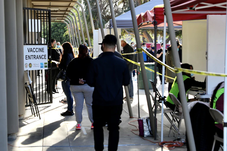 Health care stand in a line.