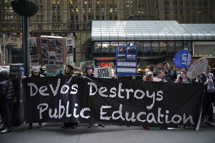 Protesters rally against U.S. Secretary of Education Betsy DeVos