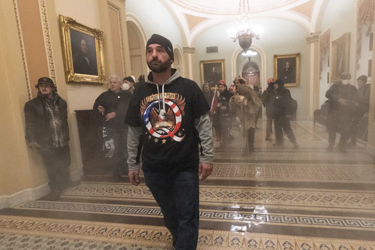 People who stormed the Capitol walk its halls