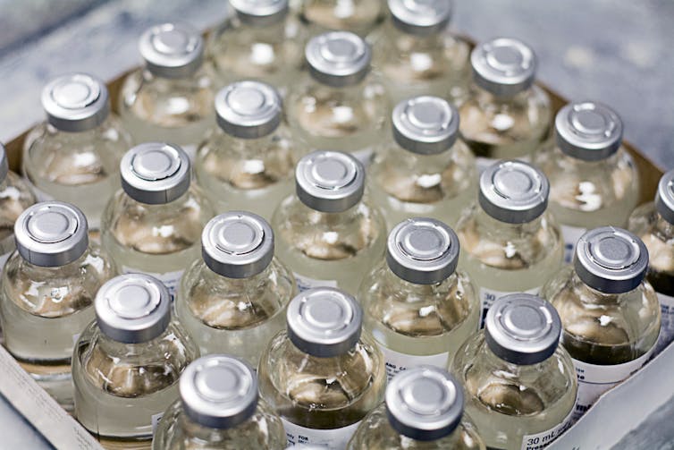 Box full of vaccine bottles