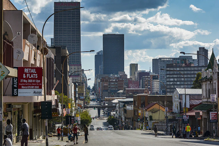 Dark clouds hover above skycrapers in downtown Johannesburg