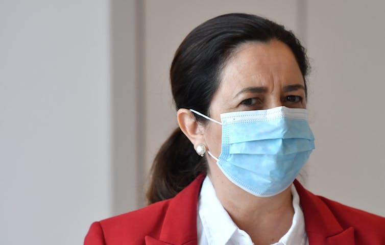 Queensland Premier Annastacia Palaszczuk wearing a surgical mask