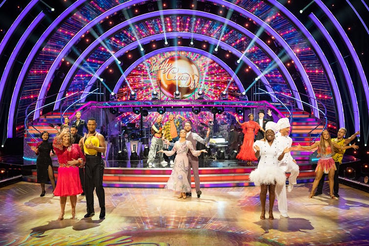 Ballroom contestants pose on Strictly Come Dancing dancefloor