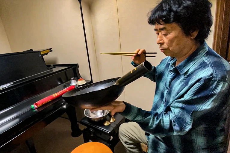 A man with a wok.