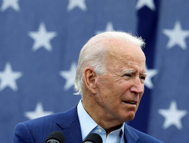 Joe Biden in front of an American flag