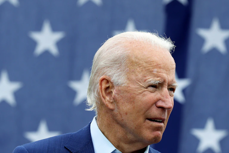 Joe Biden in front of an American flag