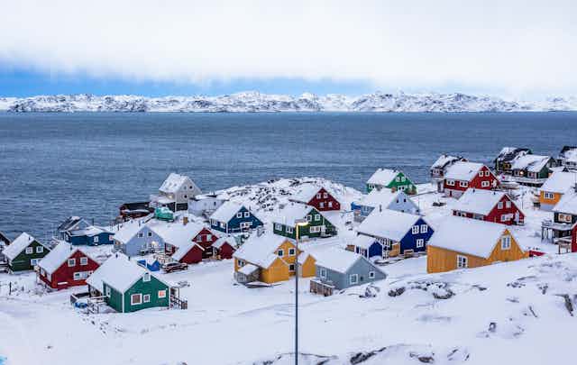 Colourful houses along a fiord outside of Nuuk, Greenland.
