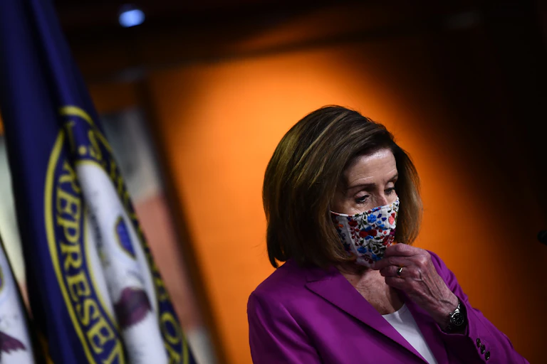 U.S. Speaker of the House Nancy Pelosi stands during her weekly press conference.