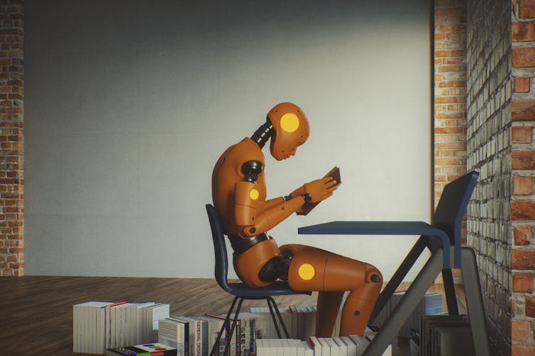 Un robot humanoide leyendo un libro.