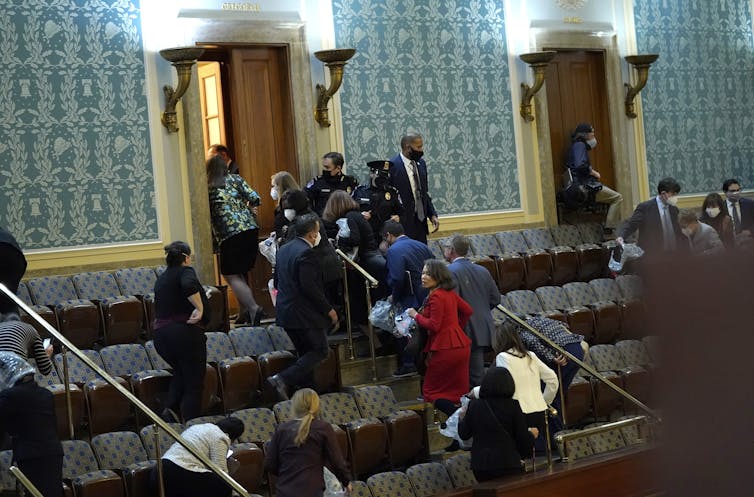 Members of Congress were forced to evacuate the House Chambers to evade protesters.