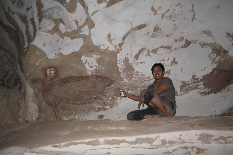 Inside the cave is a painting of warty pigs.