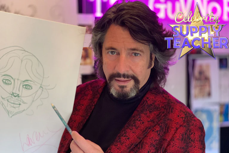 Man with goatee in snake skin blazer points a pencil at a drawing of his face.