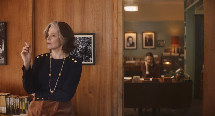 Film still. Margaret smokes, Joanna types.