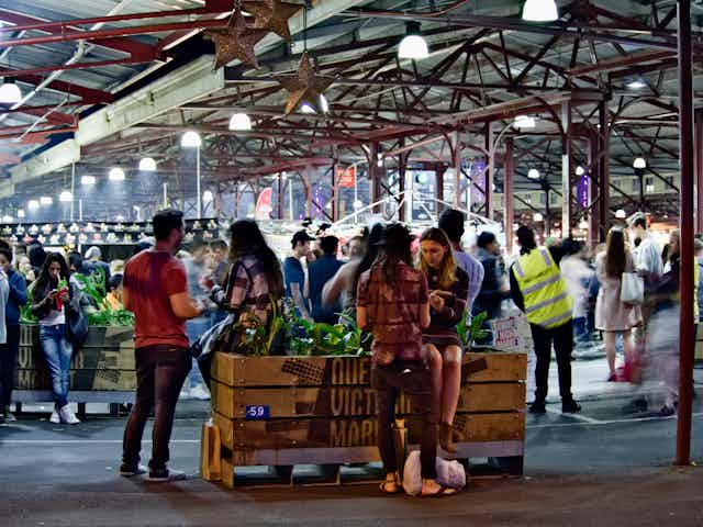 Young people at a market.