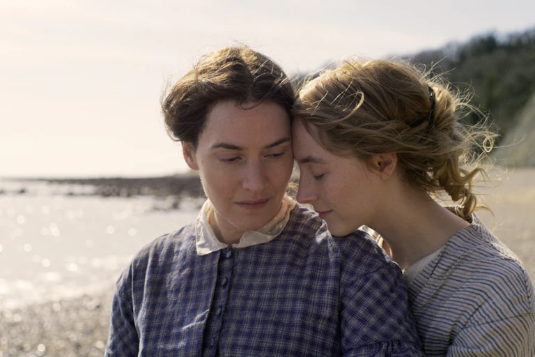 Film still: Anning and Murchison on the beach