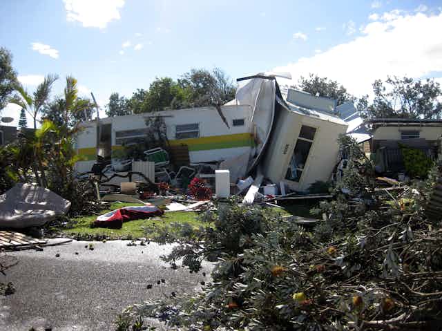 Caravans are seen tipped over by storms.