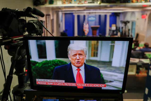 Trump on a studio screen. 