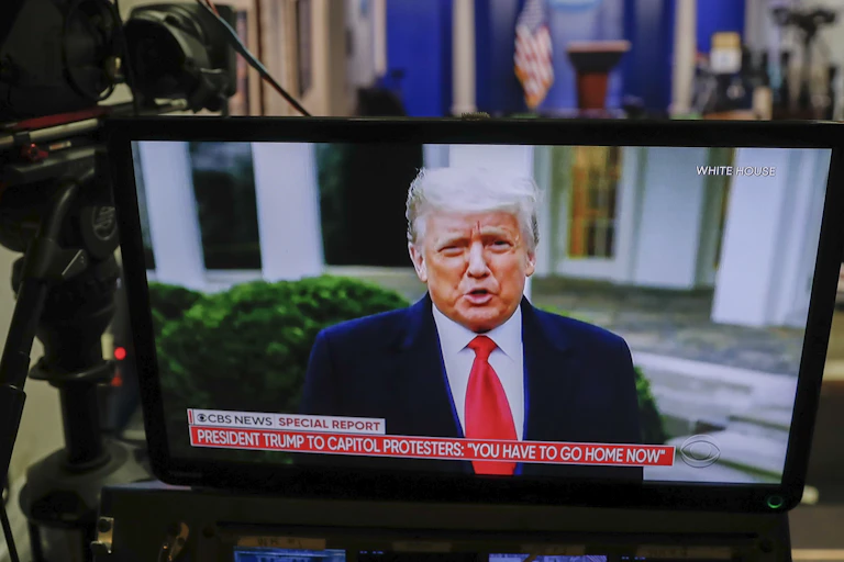 Trump on a studio screen.