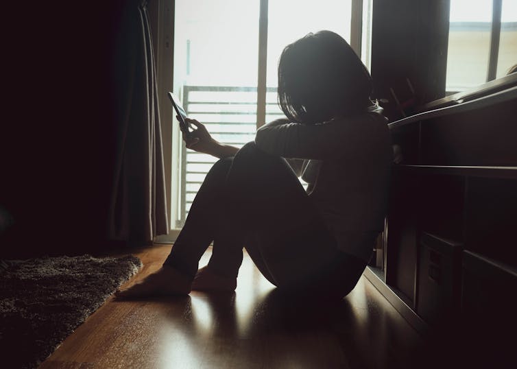 https://www.shutterstock.com/image-photo/asian-woman-sitting-on-wood-floor-1459602854