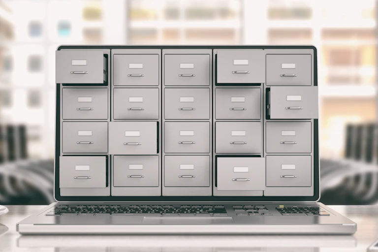 Laptop screen with filing cabinets poking out
