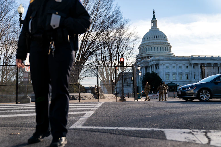 A U.S. Capitol Police Officer stands at a street corner near the U.S. Capitol as heightened security measures are put in place around the U.S. Capitol Building a day after a pro-Trump mob broke into the nations capitol while Congress voted to certify the 2020 Election Results.
