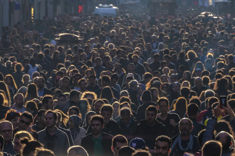 An image of many people crowded close together.