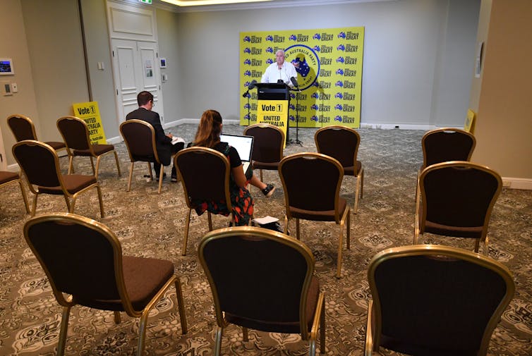 Clive Palmer speaks to a near-empty press conference.