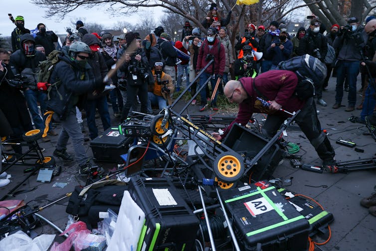 A pile of damaged news equipment, including cameras, at the Capitol riot.